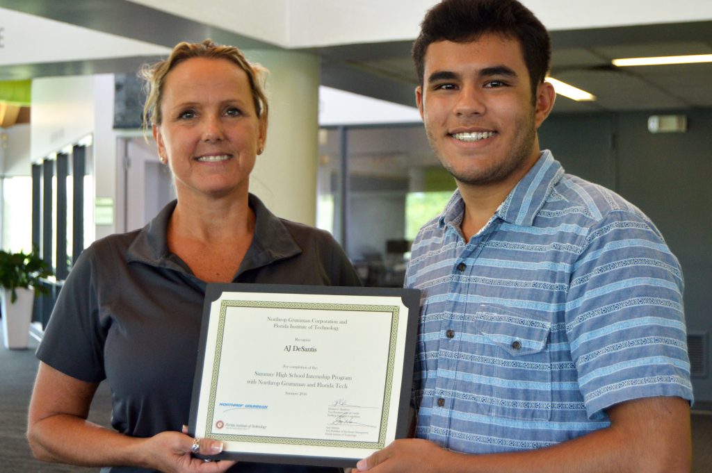 Northrop Grumman Intern, AJ DeSantis, accepts his award in the Florida Tech Digital Scholarship Lab on Aug. 5.