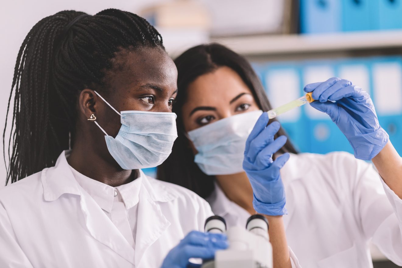 two women working together in a microbiology lab
