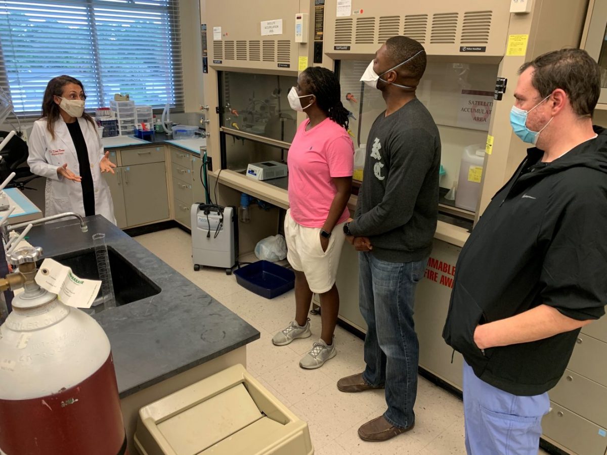 Students from Burrell College of Osteopathic Medicine speak to Florida Tech assistant professor Kenia Nunes, a vascular biologist, during a recent tour of campus. Nine Burrell students are on the Space Coast to participate in clinical rotations at Steward Health Care facilities.