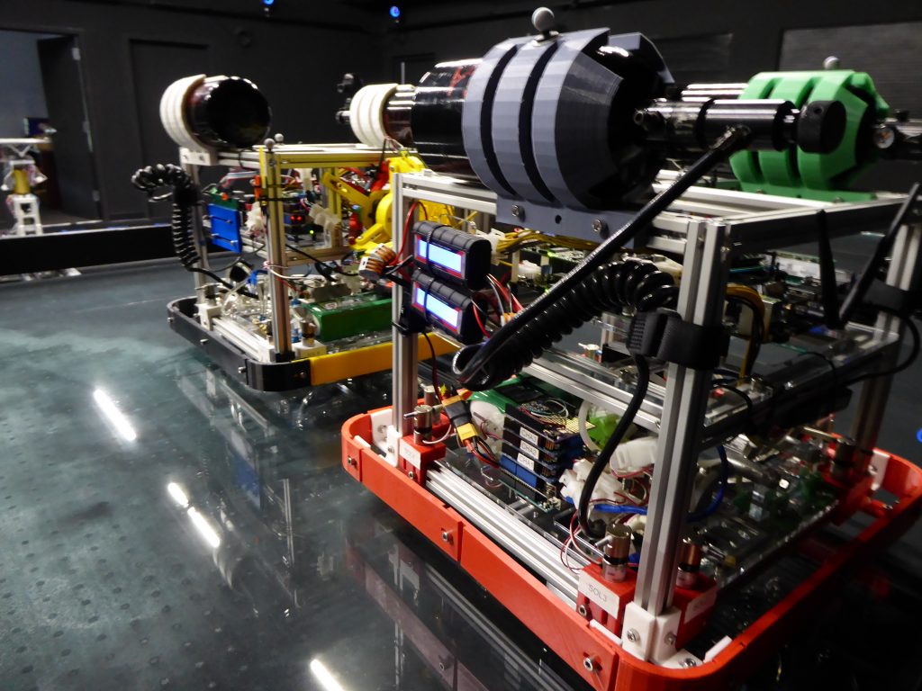 Air-bearing vehicles (ABVs), seen here and used for experiments in the ORION Lab, have capabilities and limitations similar to actual small spacecraft.