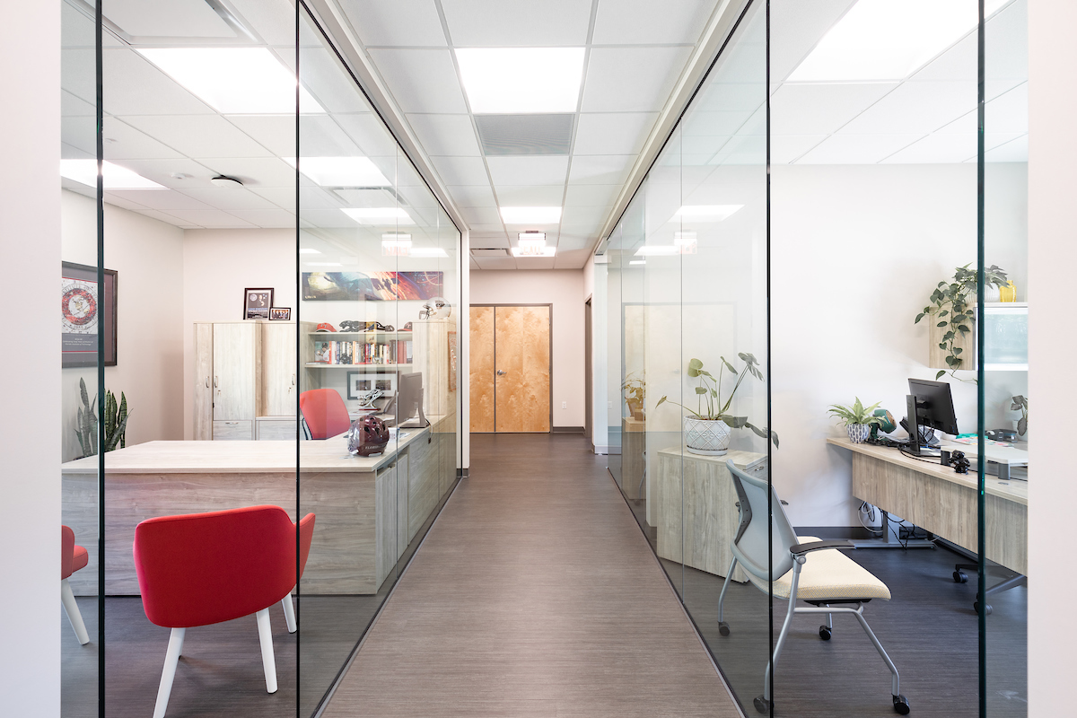 Glass walls line the hallway in Folliard Alumni Center.