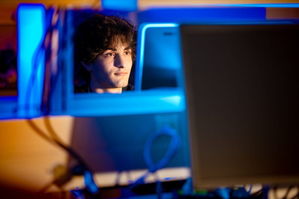 Florida Tech student Louie Orcinolo in the IoT Security and Privacy lab.