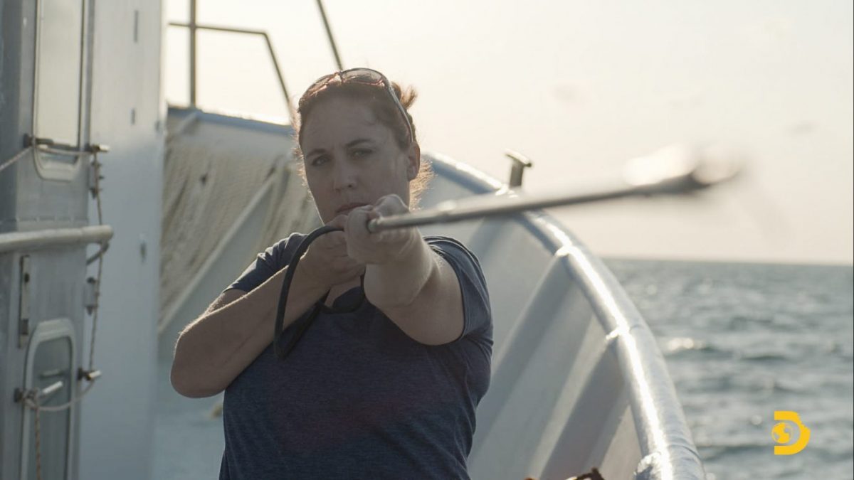 Toby Daly-Engel on a boat with equipment during the filming of a Shark Week program..