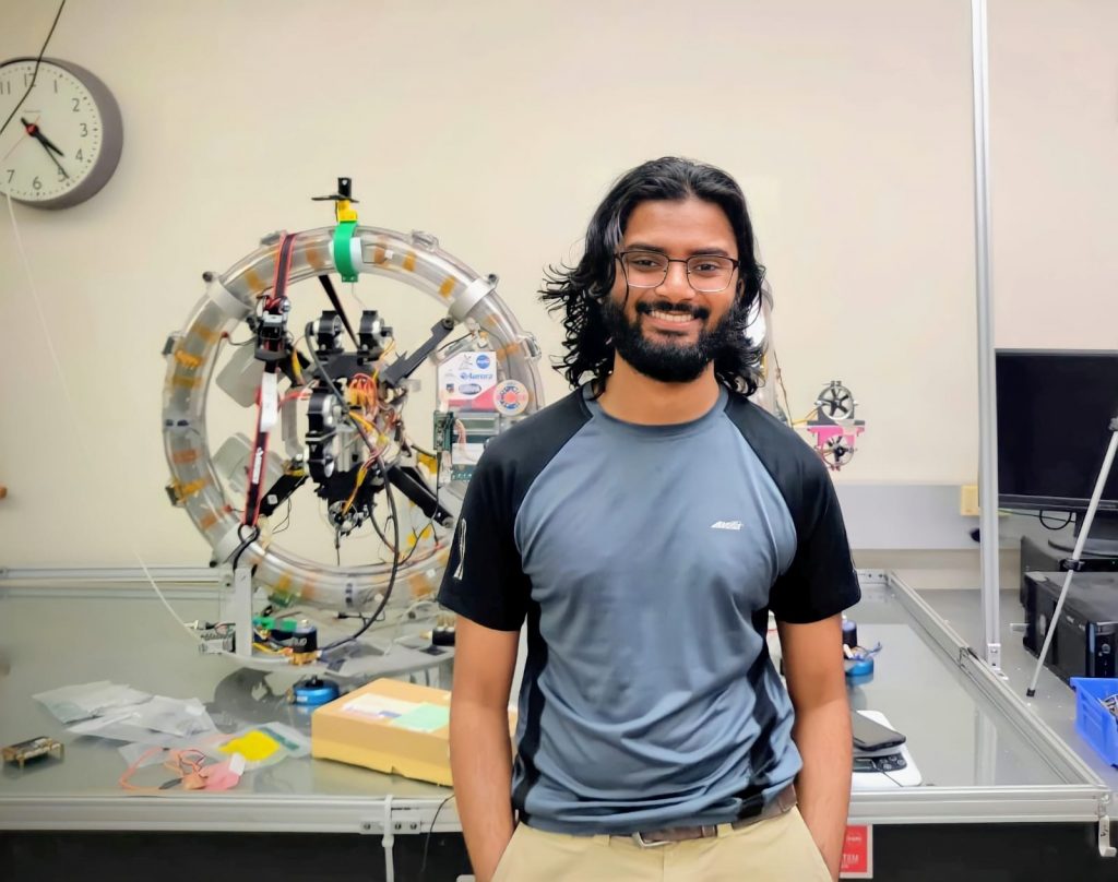Mamoon Syed standing in lab used by aerospace engineering students