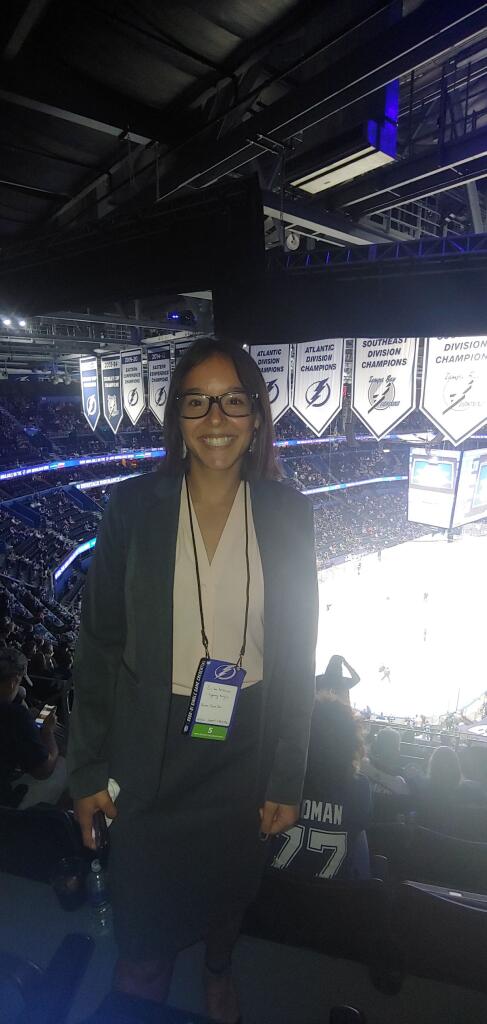 Erika Ambrioso ’20 at a Tampa Bay Lightning hockey game in Amalie Arena, where her office is also housed.
