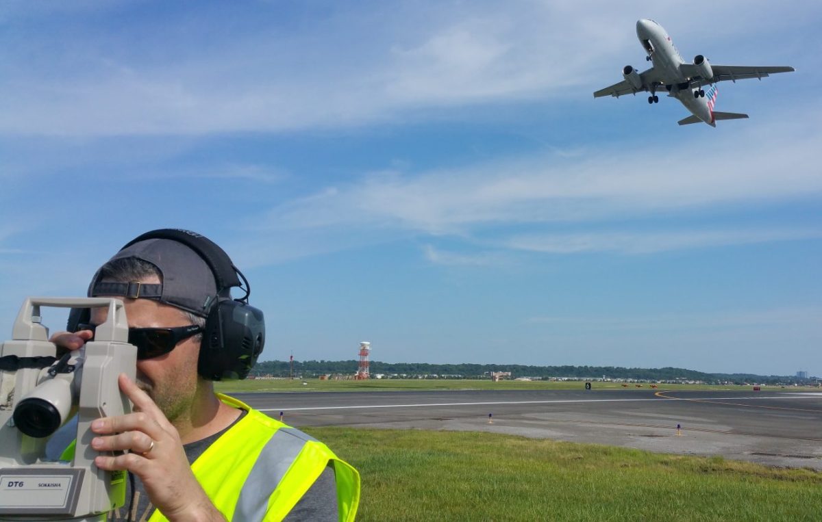 Mike DiPilato ’05 prepares to conduct a survey of a precision approach path indicator at Ronald Reagan Washington National Airport in Washington, D.C.