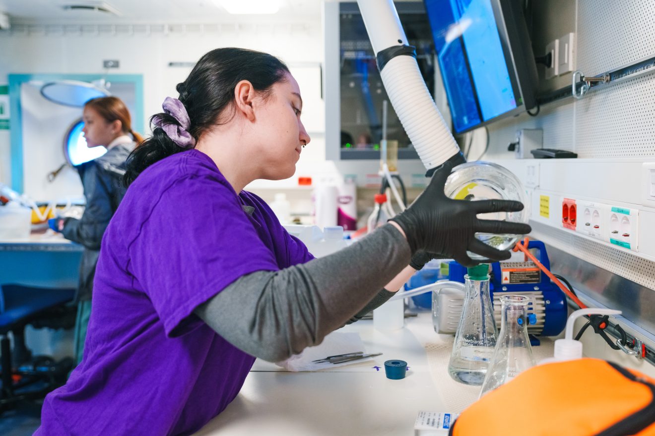 Caitlyn Hubric processing water.