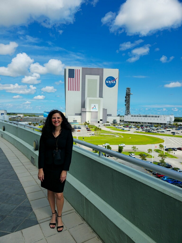 Carstens standing in front of the Vehicle Assembly Building.