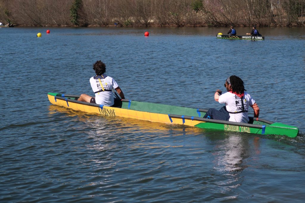 ASCE students paddling their canoe. 